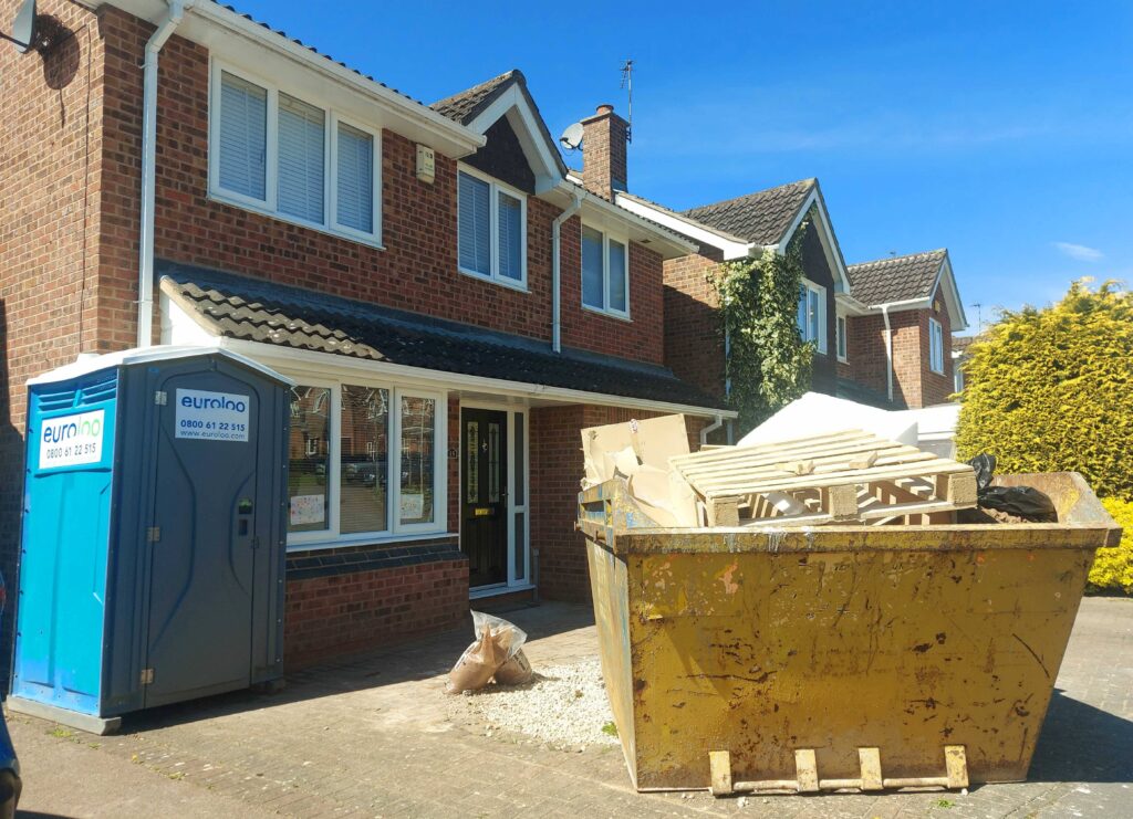 euroloo with skip outside a home