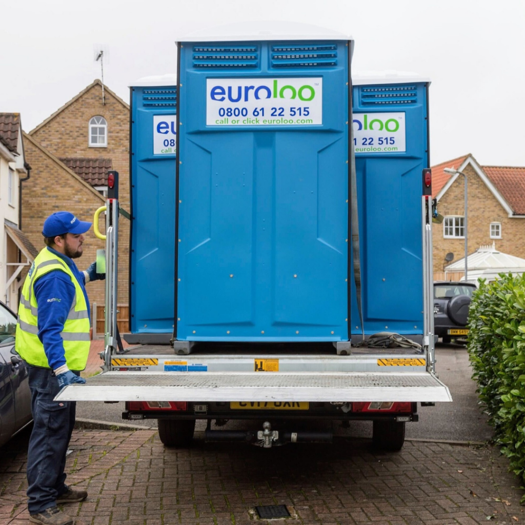 Euroloo Driver Delivering Portable Toilets To A Small Construction Site In The Uk.