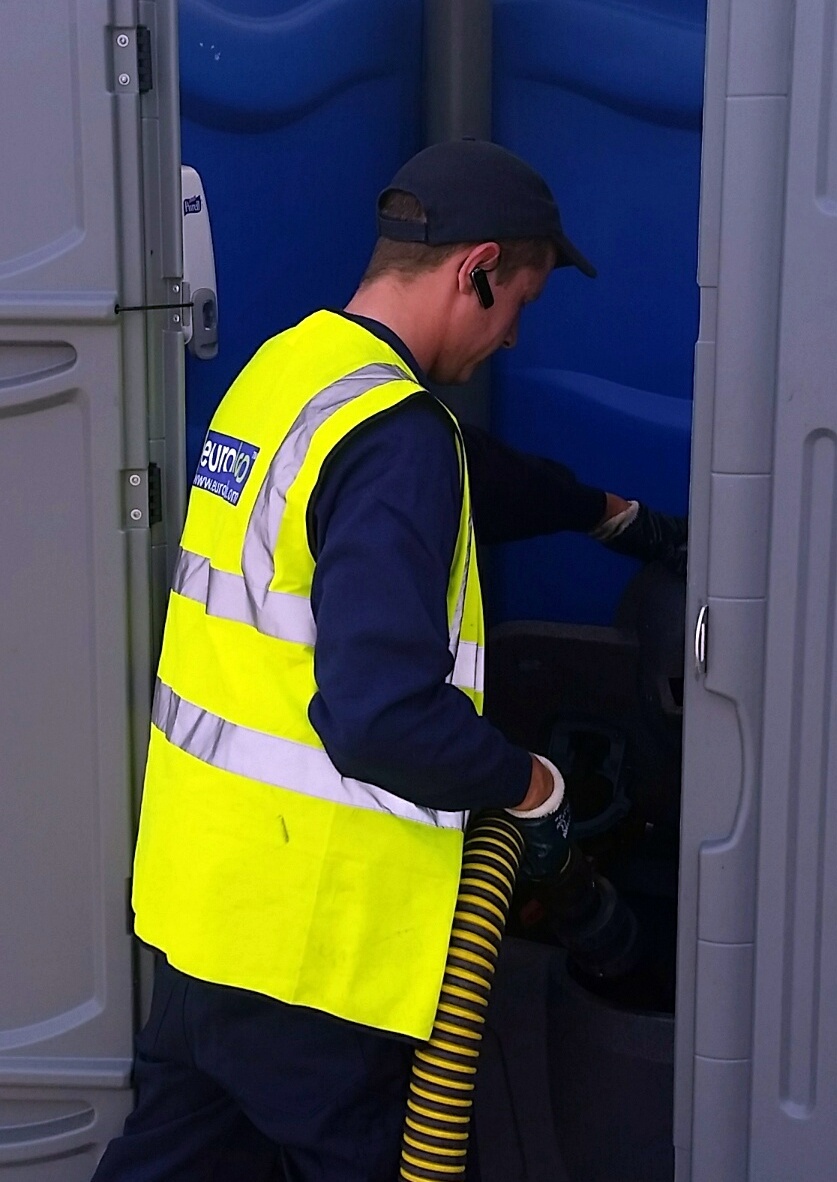 Portable toilet servicing