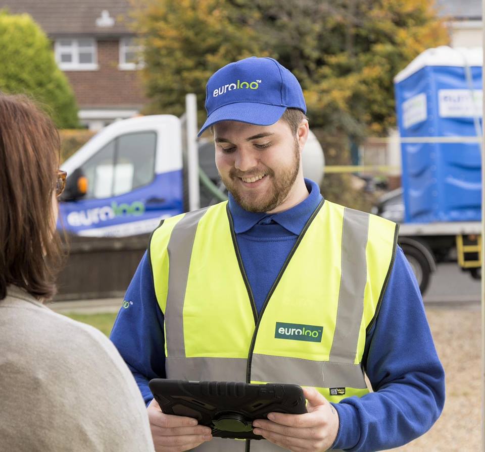 Service driver working on construction site in Chelmsford servicing portable toilets