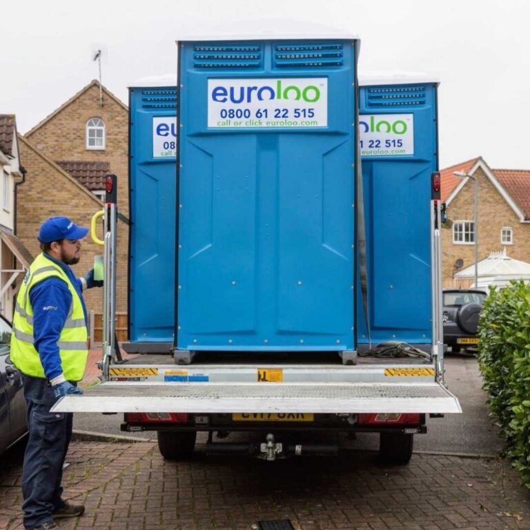 Euroloo Driver Delivering Portable Toilets To A Small Construction Site In The Uk.