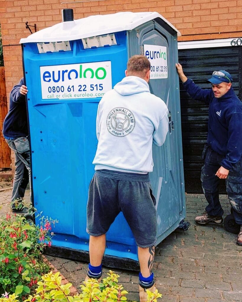 Builders’ Portable Toilet On A Uk Building Site Showing Typical Hire Cost Of £40 Per Week