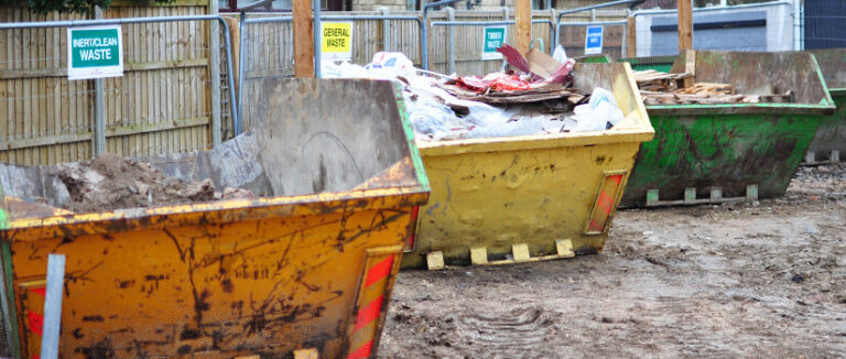 Construction Site With Waste Segregation Skips For Swmp Compliance In Uk Projects