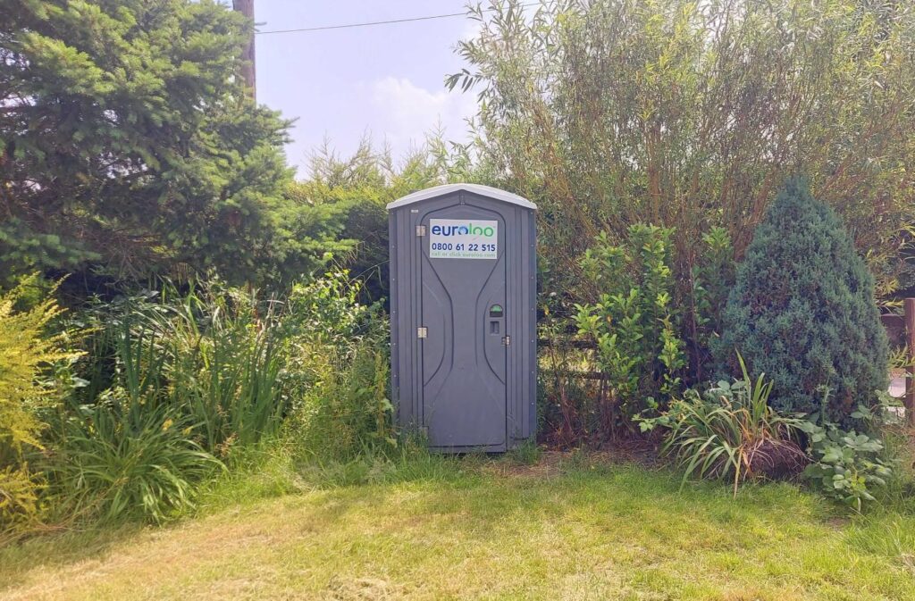 A euroloo toilet in greenery