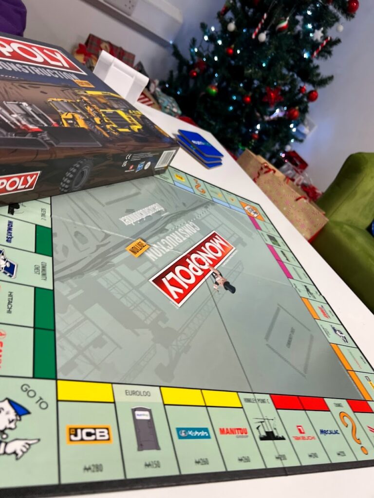 Construction Monopoly Board At Euroloo Office With Christmas Tree And Euroloo Property Square, Used For Christmas Gift Ideas For Builders Article.