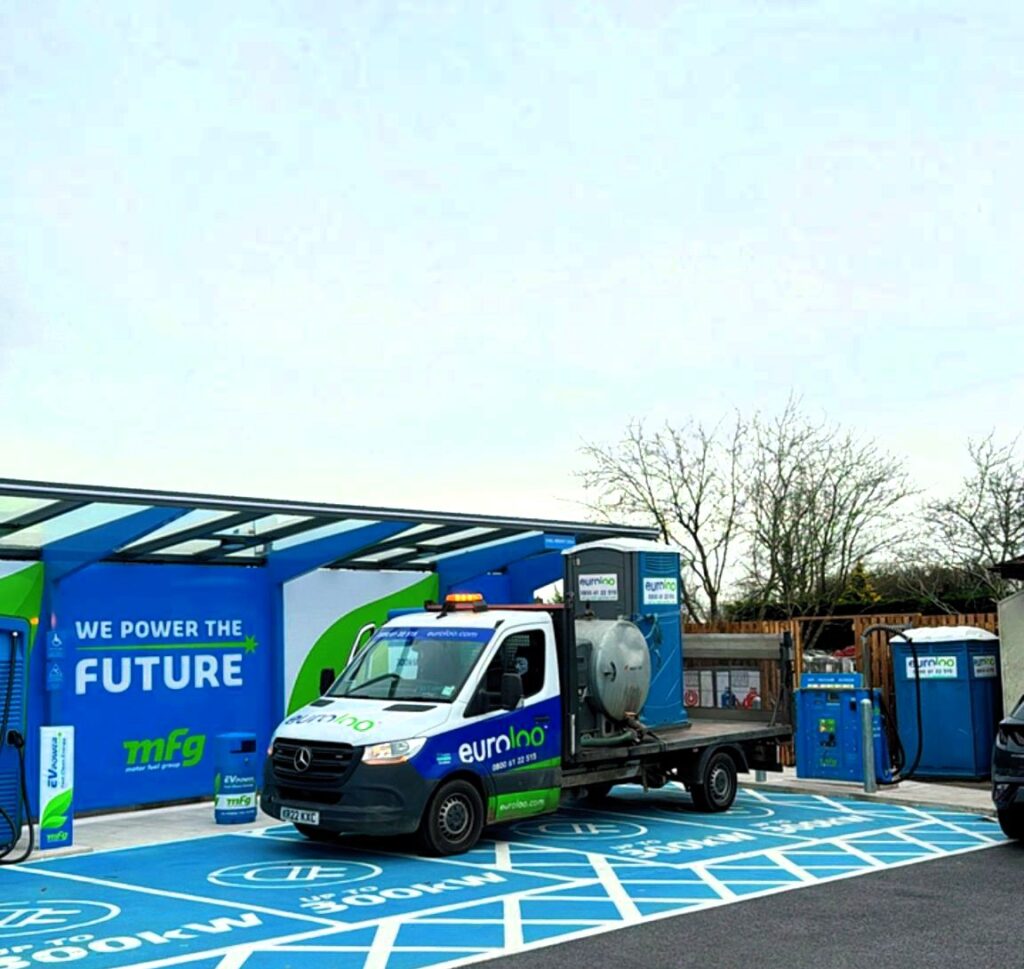 Euroloo Welfare Vehicle Parked Beside Ev Charging Station During Commercial Installation