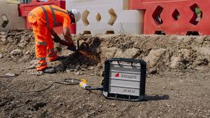 Construction Worker Using An Instagrid Portable Power Station On A Uk Site In 2025